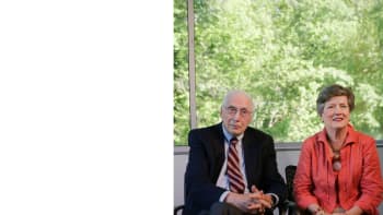 Alumni and donors Gene and Helen Bottoms sit for an interview in front of a window.