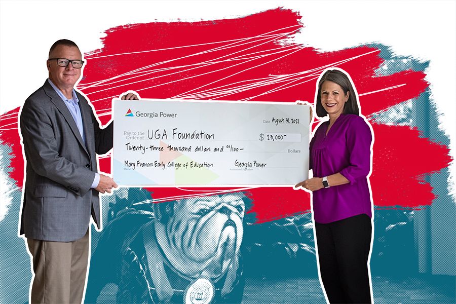 Dean Denise Spangler accepting a donation from Georgia Power.