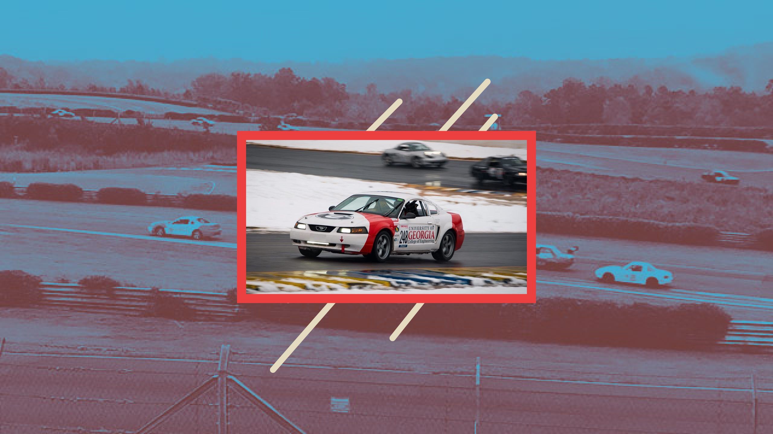 Race car designed by the UGA chapter of the Society of Automotive Engineers speeds around a track.