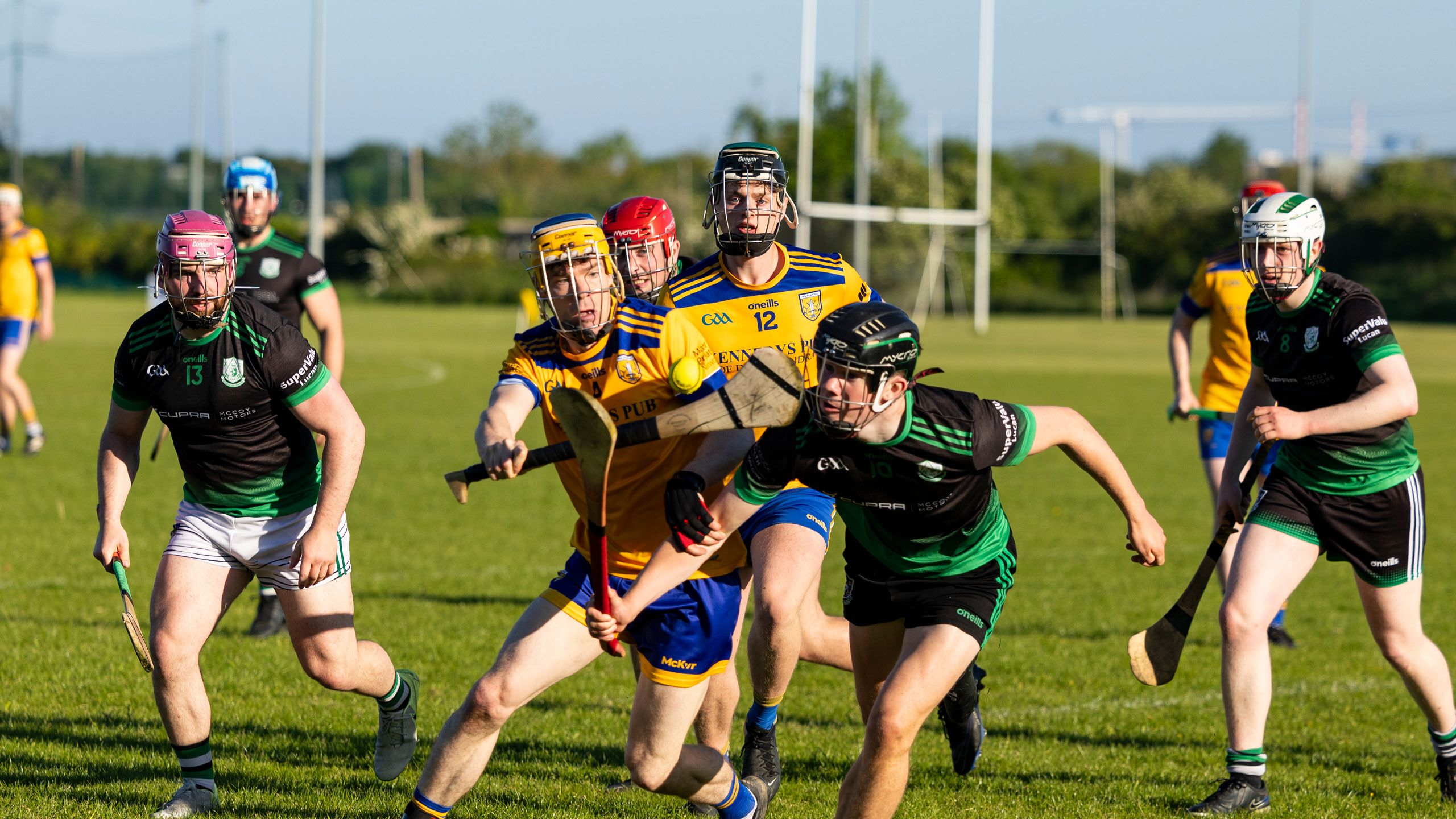 Hurling action during a match between Na Fianna and Lucan Sarsfields at Na Fianna Gaelic Athletic Association (GAA) in Dublin.