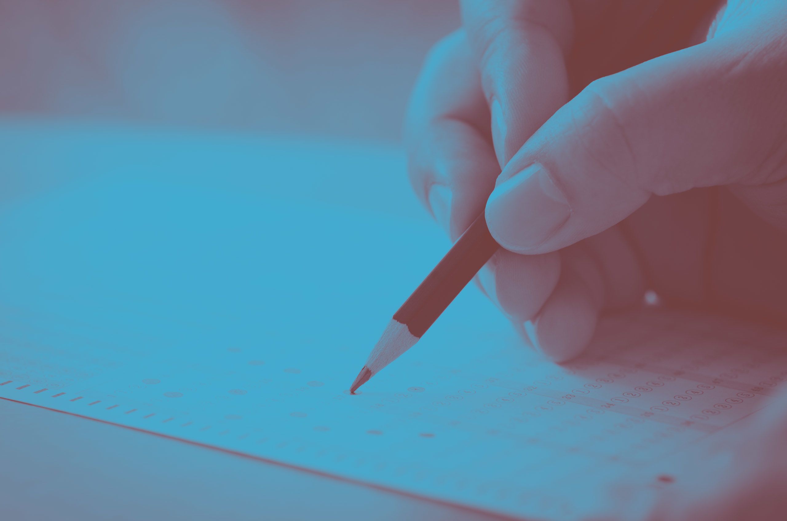 Close-up photo of student filling out a scantron test.