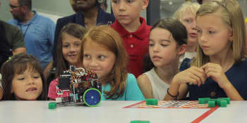 Photo of students in a robotics lab.